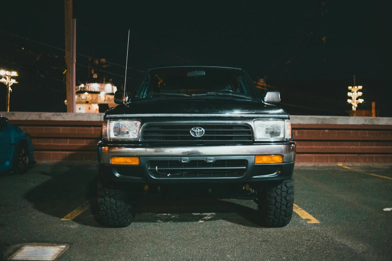 a silver truck parked in a parking lot