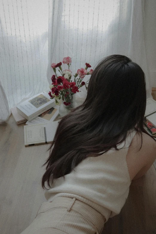 an image of a woman at a desk reading