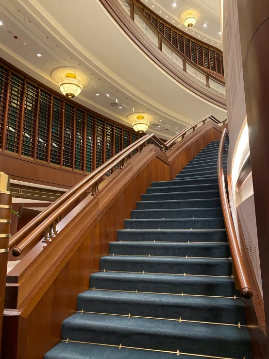 a staircase inside the palace features blue carpeting