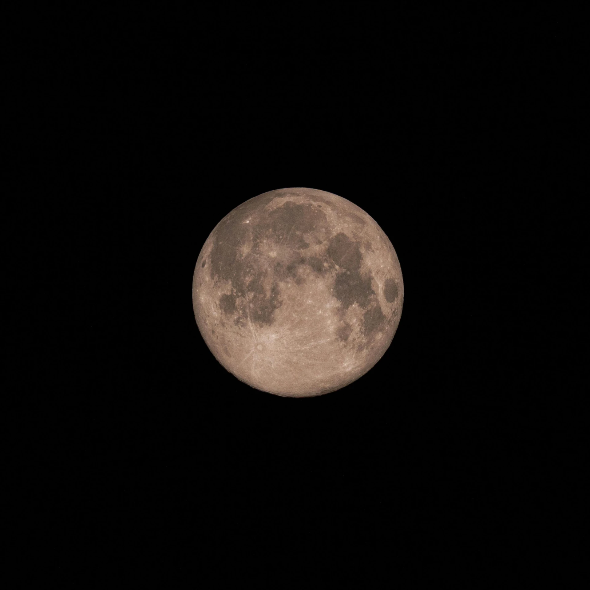 the full moon against a dark black background