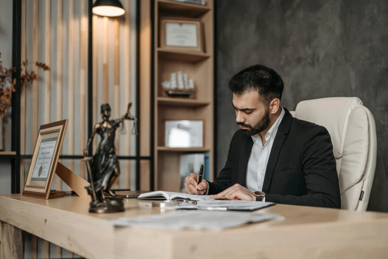 the man is studying in his home office