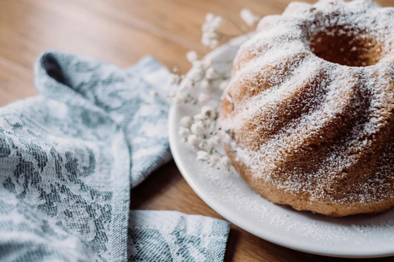 there is a sugared bundt cake on the plate