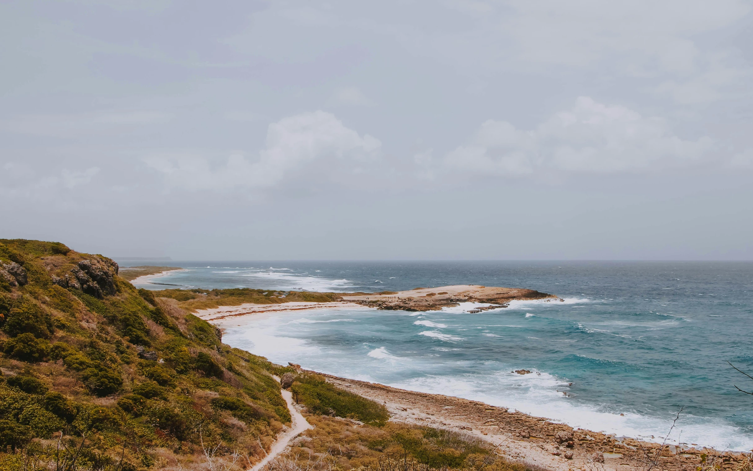 a landscape view of the coast, and surrounding an island