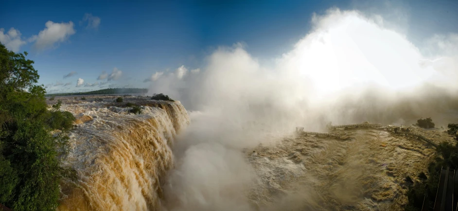 the water is brown and pouring into the air