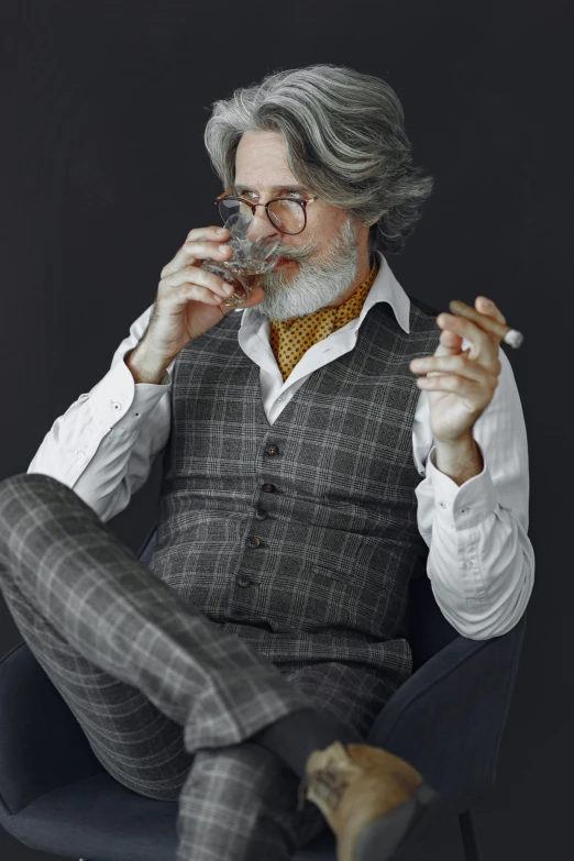 a man sitting in a chair smoking and smoking cigarette
