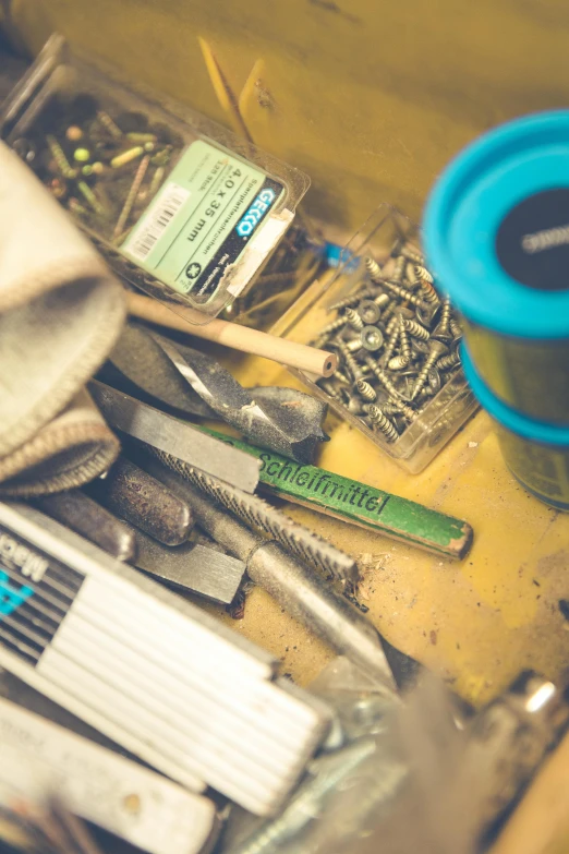 a table full of screws, pliers, screwdrivers and other materials