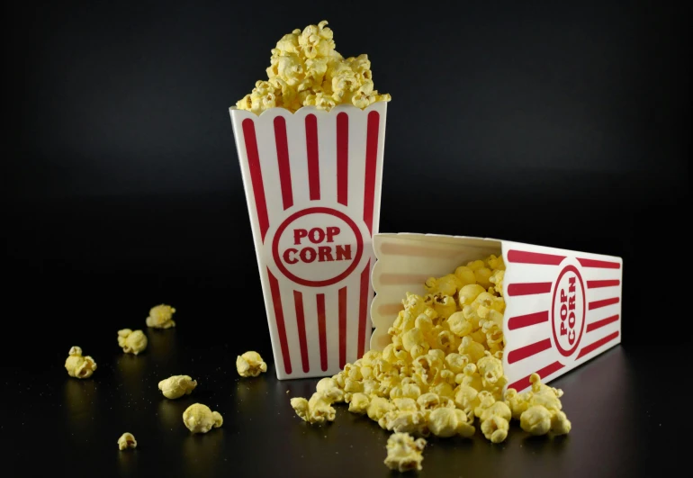 a popcorn bowl and cup filled with popcorn