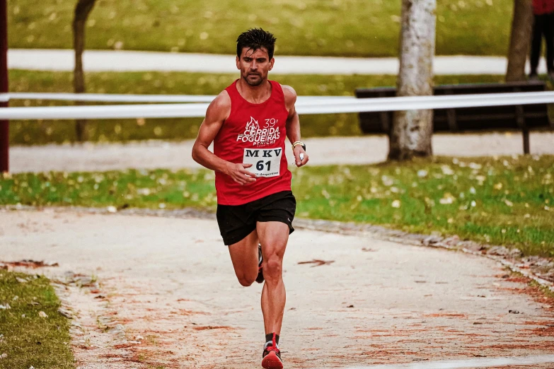 a runner runs through the mud during a run