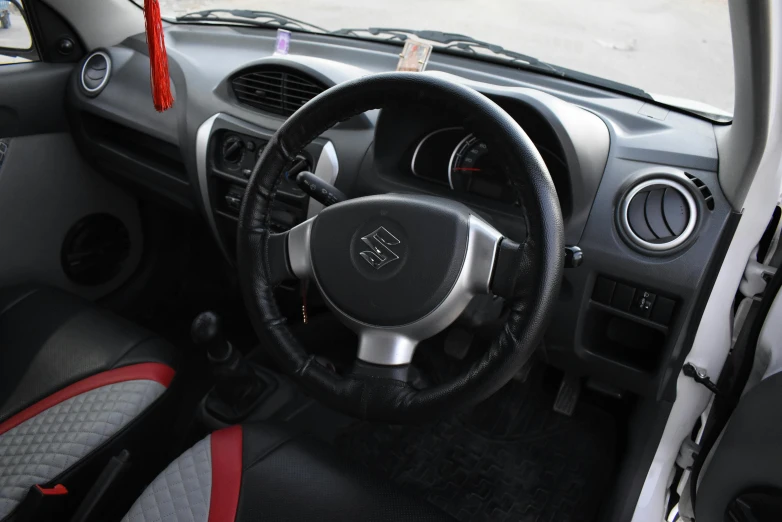 an interior of a car with a steering wheel