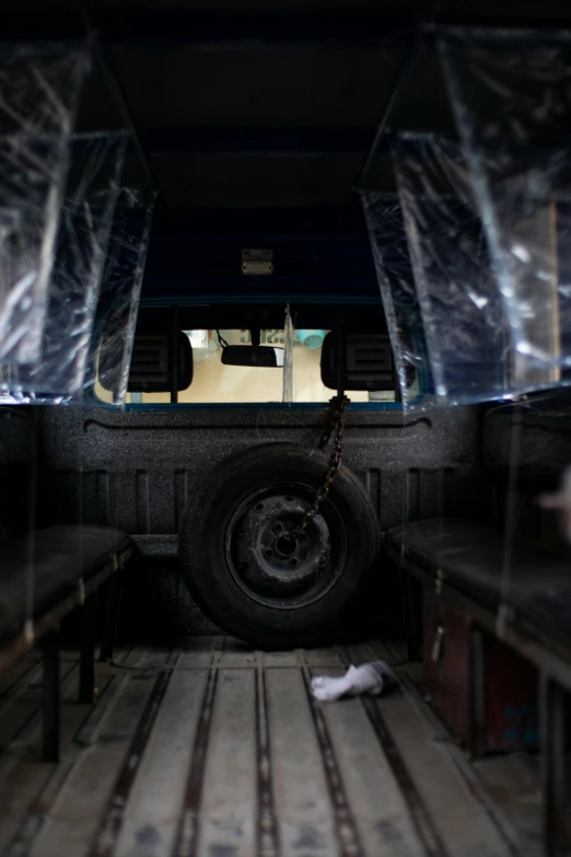 a close up of a cargo truck under a window