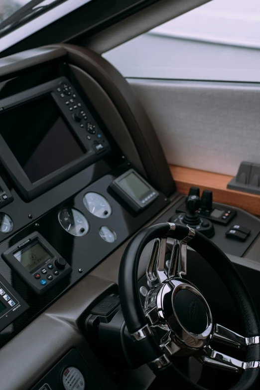 view from a cockpit cockpit with a steering wheel, and a computer screen