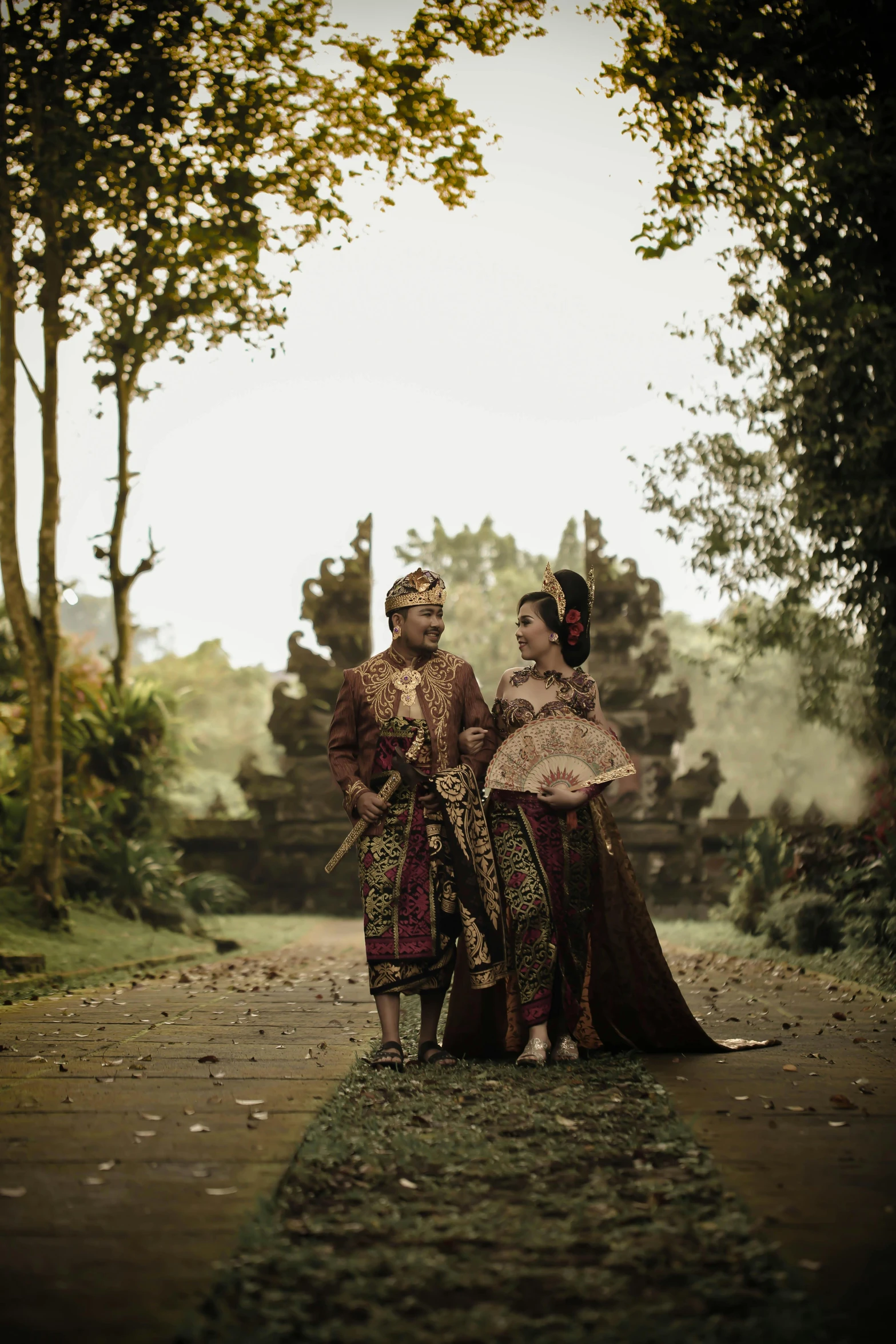 two people in costume standing on the road