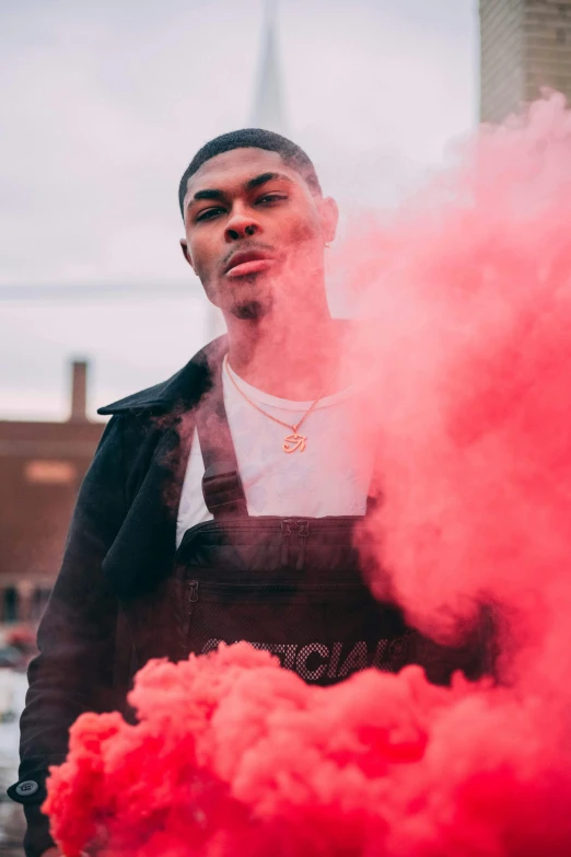 a man with a white shirt and red smoke