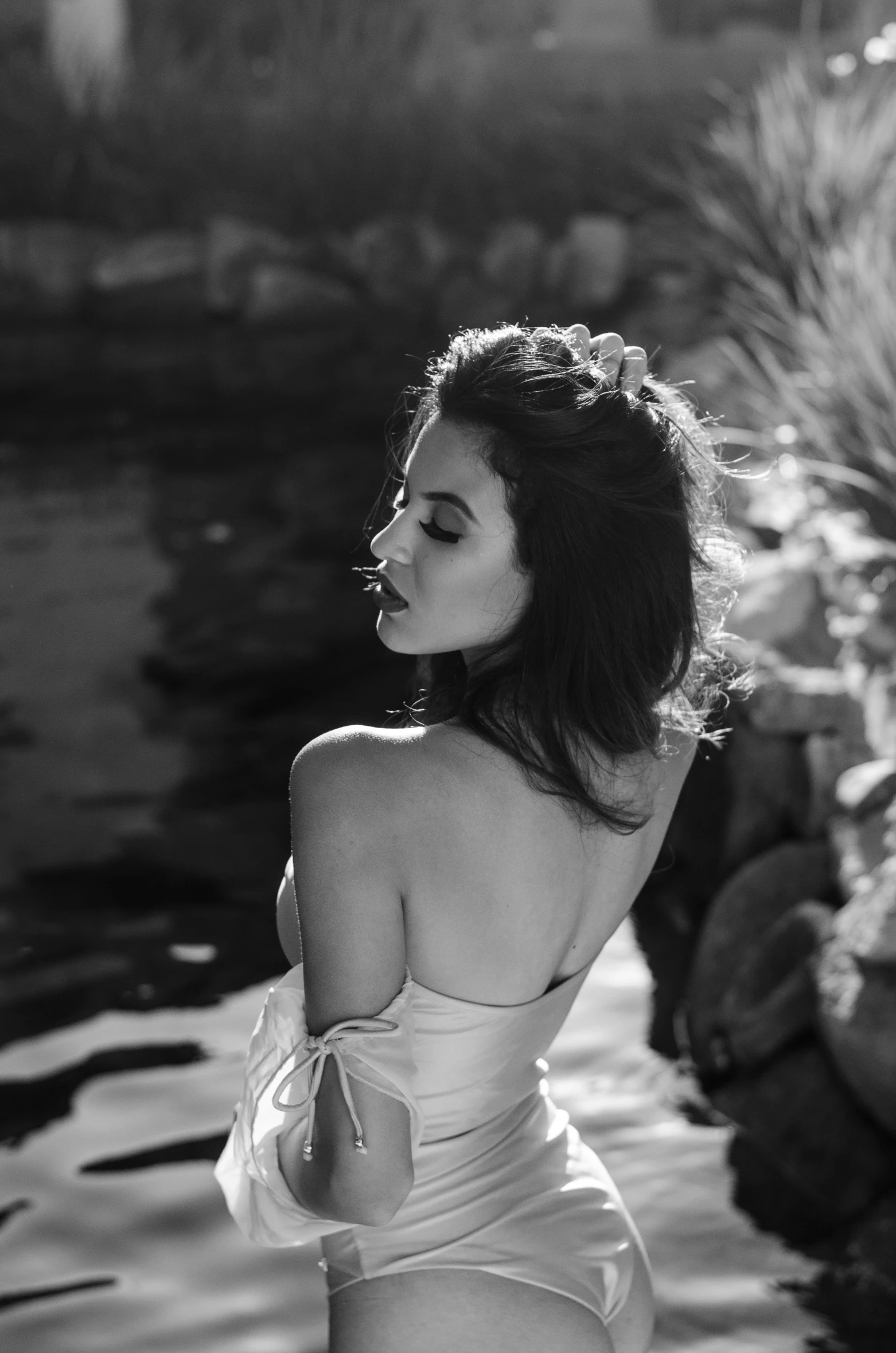 black and white image of a woman in a bathing suit