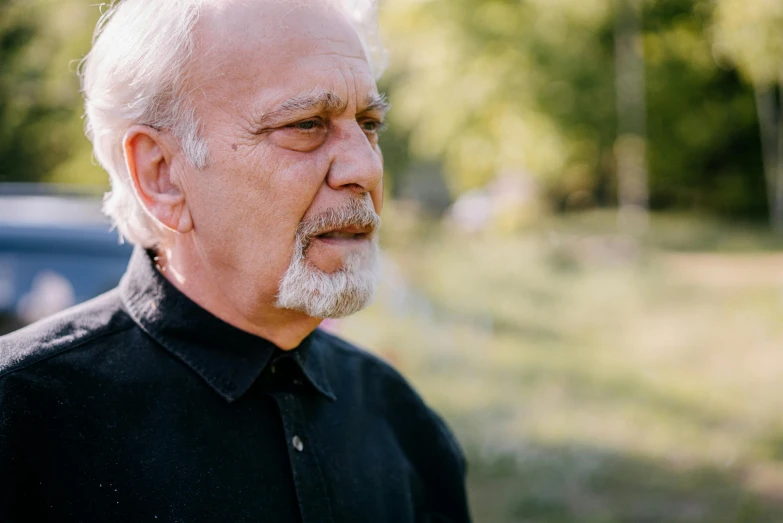 an older man with a long white beard and grey hair