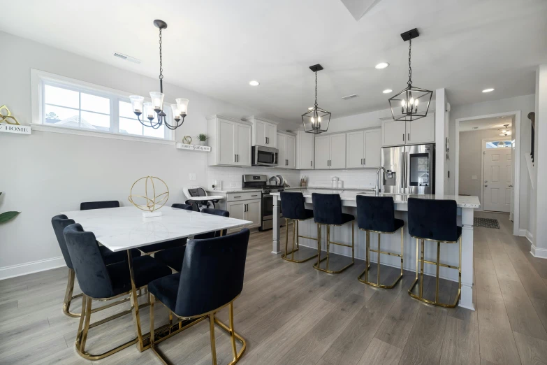 a kitchen with a bar, oven and sink