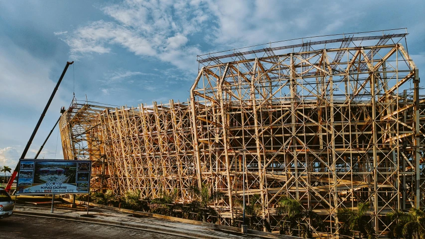 an old fashioned wooden structure is being worked on