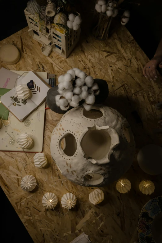 two bowls, some decorative objects and papers on a table