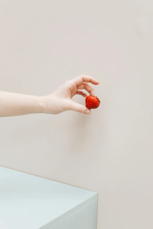 a person holding the corner of their wall to reach it with their arm