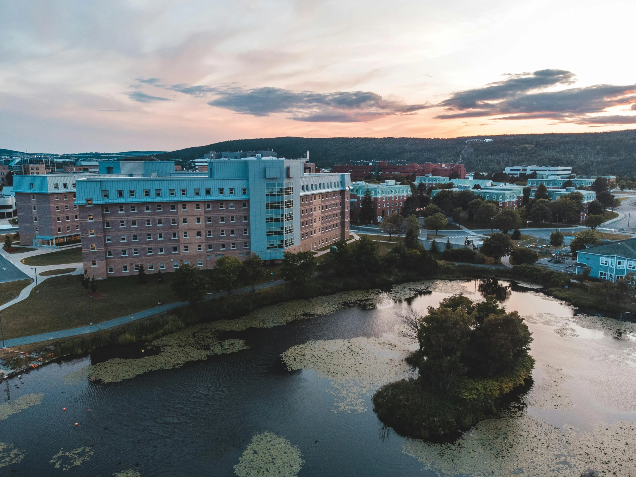 an aerial view of a few buildings and the waters