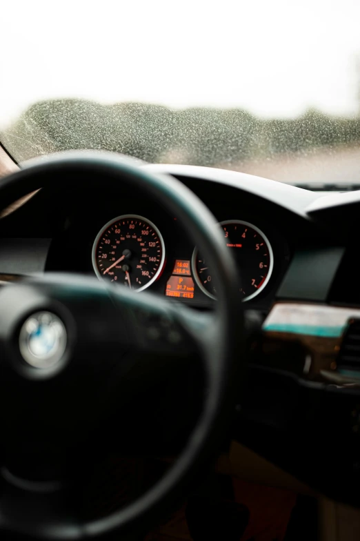 the dashboard of a modern car with some warning lights