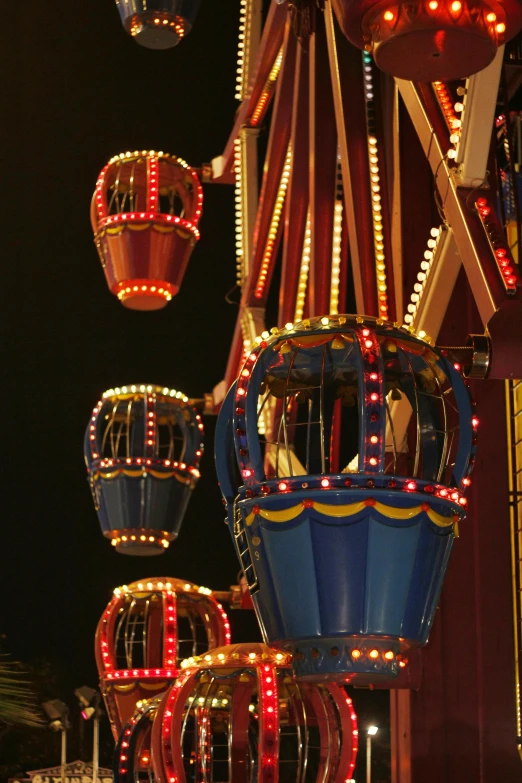 a colorfully lit ride on the carnival at night