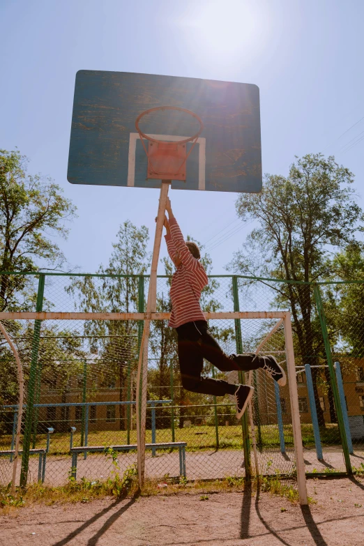 a man is jumping up to hit the basketball