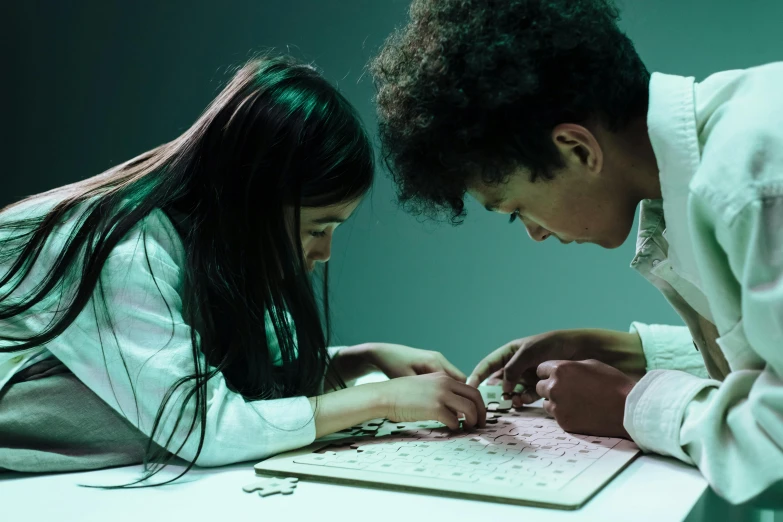 a couple are looking at the papers on the desk