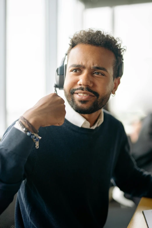 there is a male professional telephone operator smiling