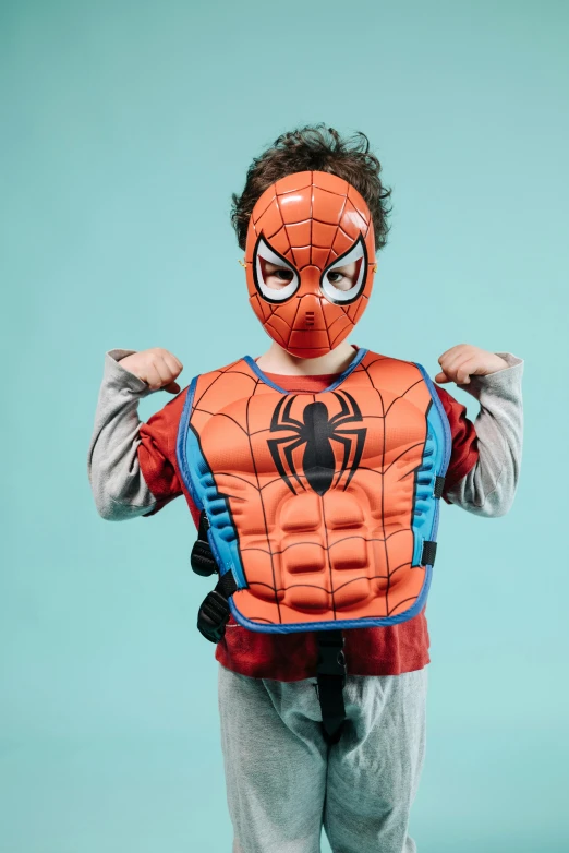 a  wearing a spider - man costume on his body