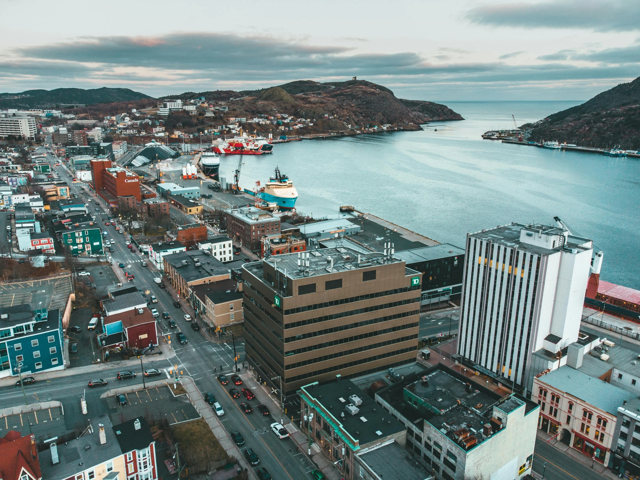 an aerial view of the city area of a small coastal town