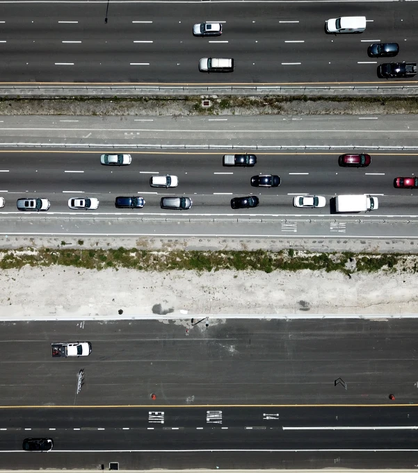 an aerial view of several lanes of traffic
