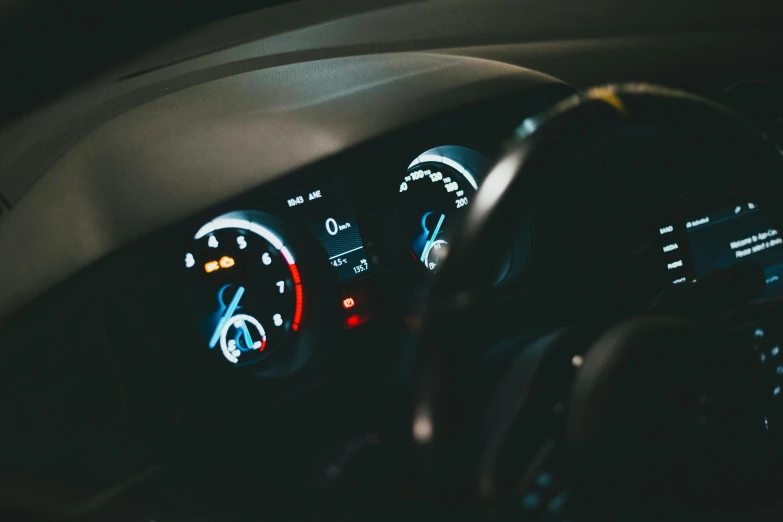 dashboard s of car with gauges showing