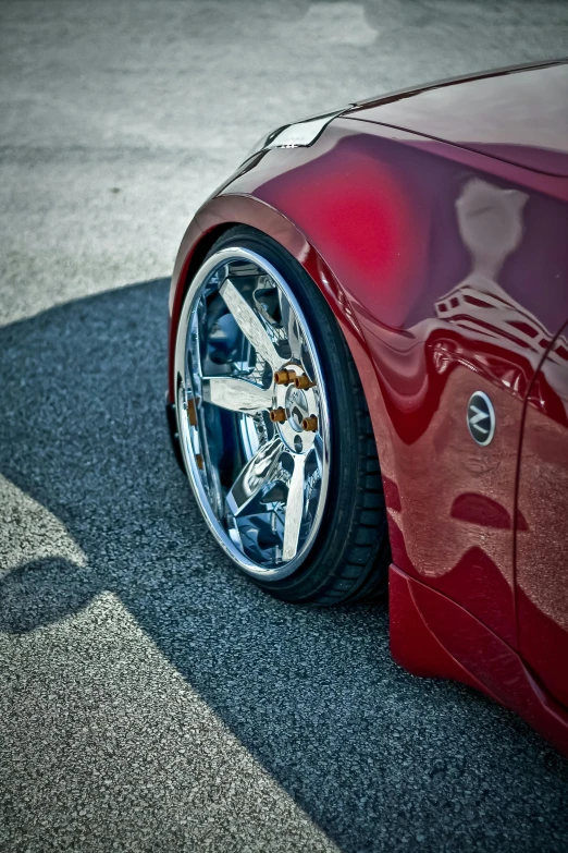 a car with chrome wheels on it's rim