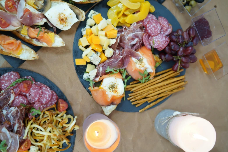 a table topped with plates filled with different types of food