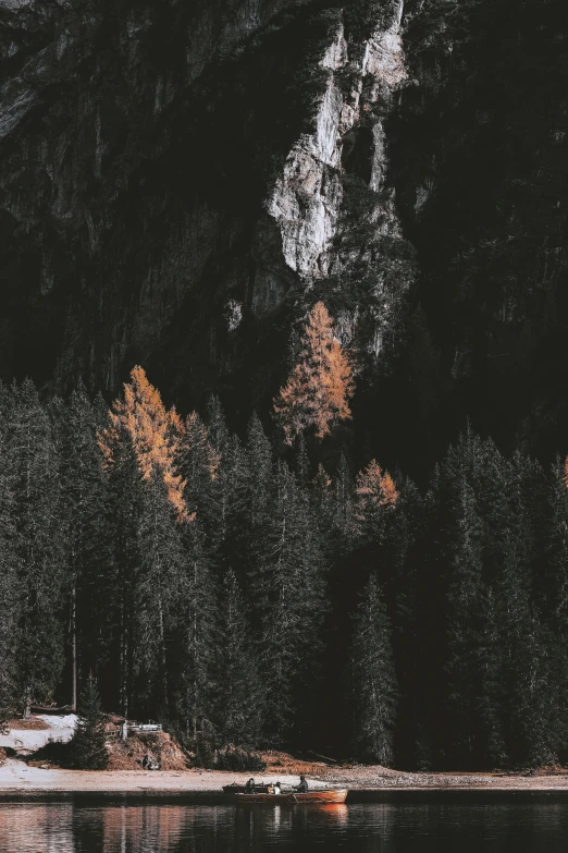 mountains in the dark are reflected on the water