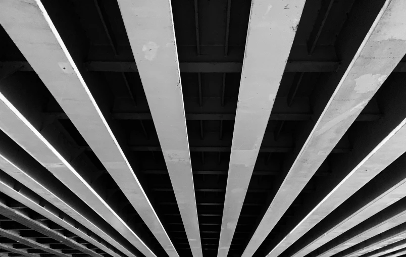 a bridge with a metal ceiling and lots of slats