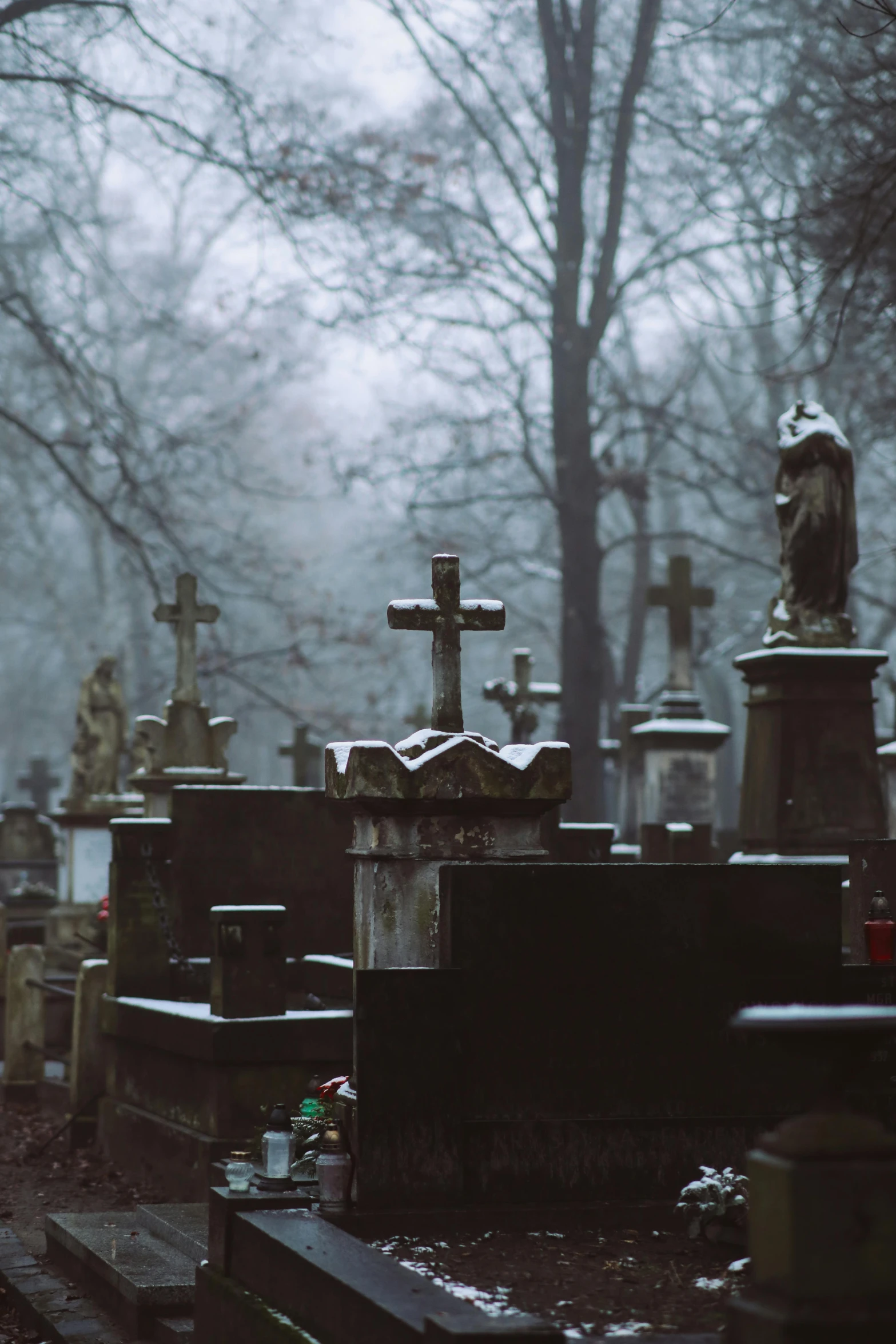 some heads of tombstones on top of them