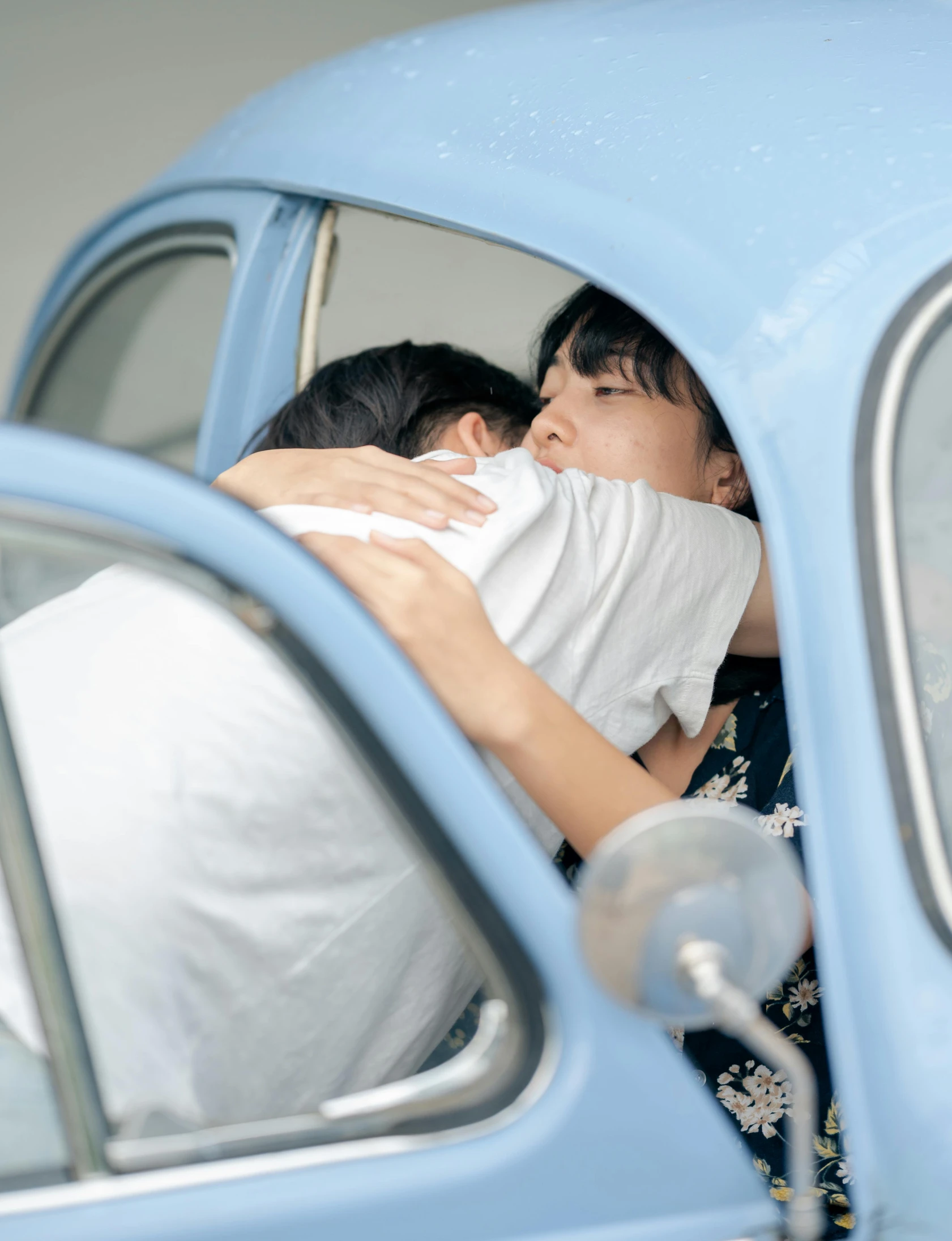 two people that are sitting in a car