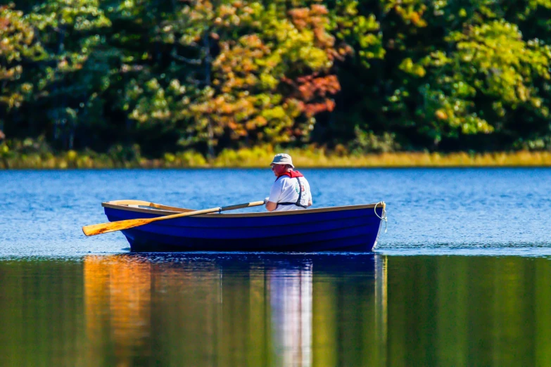 a man rowing a boat on the river