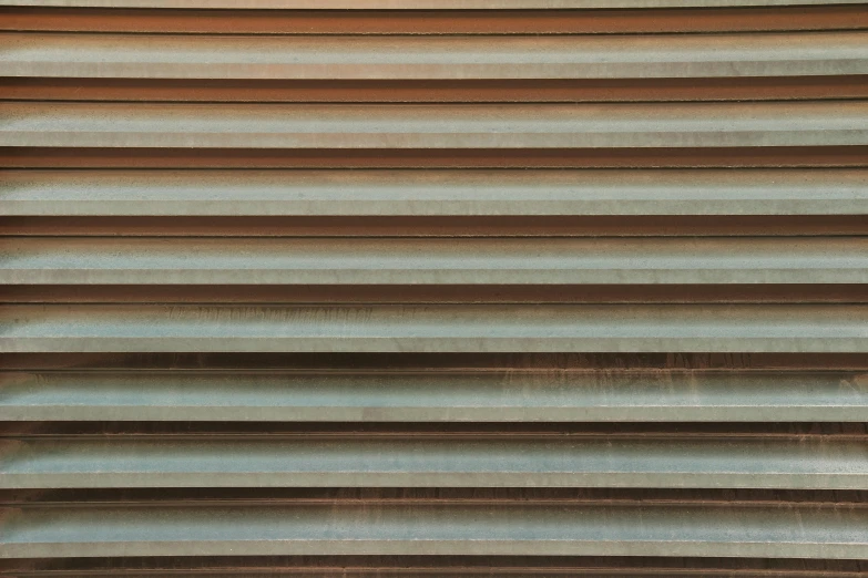 a close up of a wooden shutter in the dark