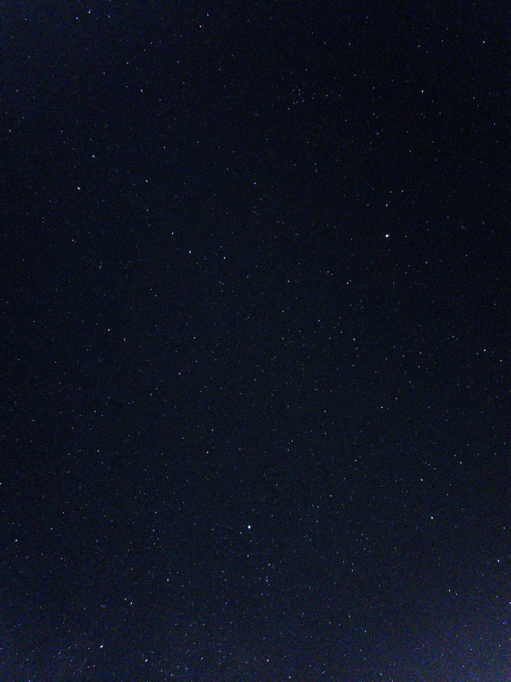 several stars shining above a dark sky at night