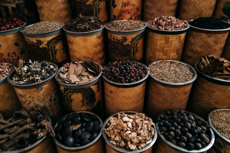 many bowls that are filled with different types of nuts