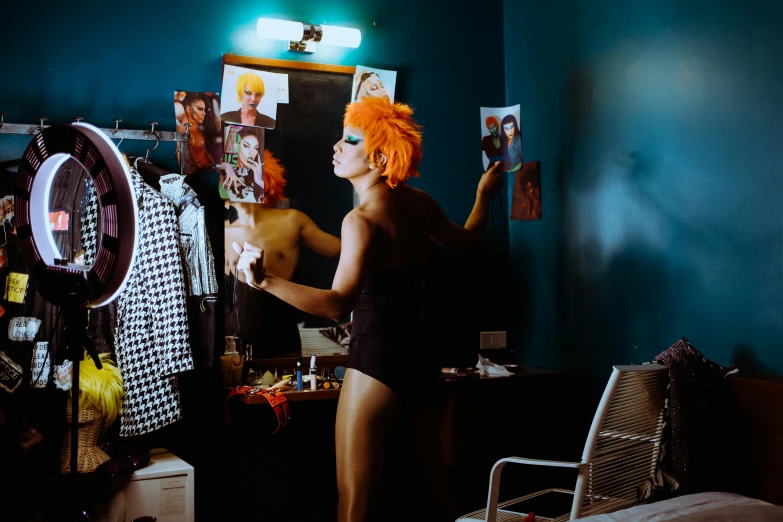 the person with the orange wig is looking in a mirror