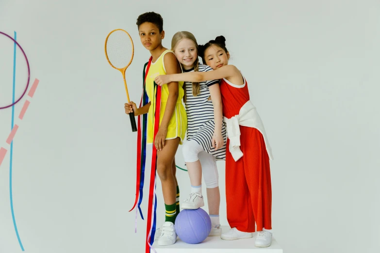 four little girls with their arms around each other