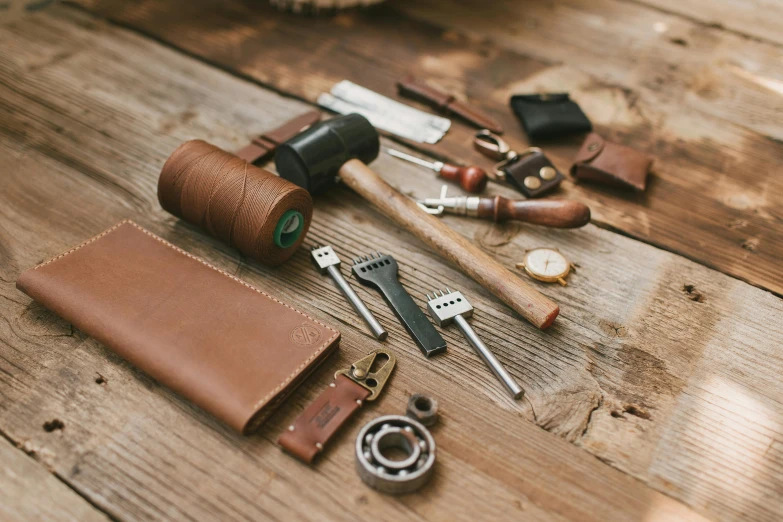 some tools and a wallet laid out on a table