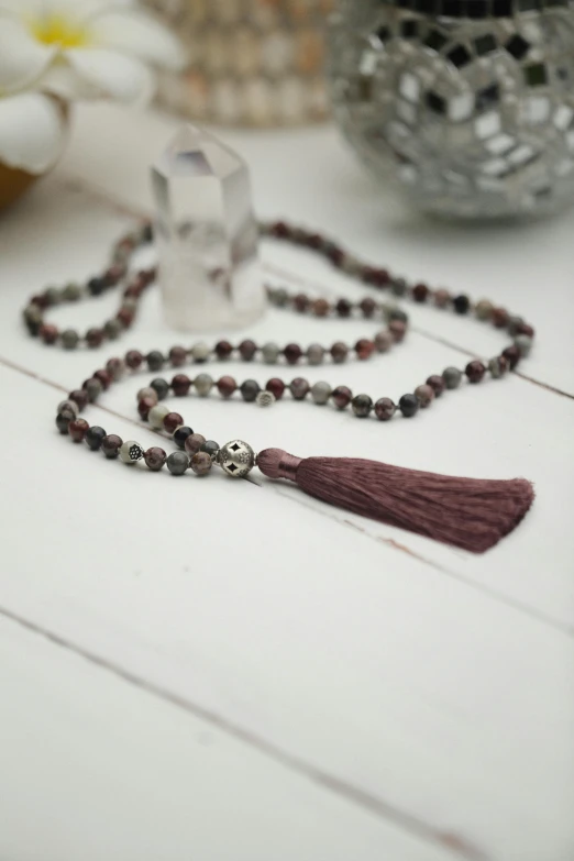 a rosary with bead and a tassel on it