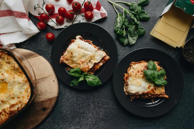 the pizza is served next to the other plates on the table