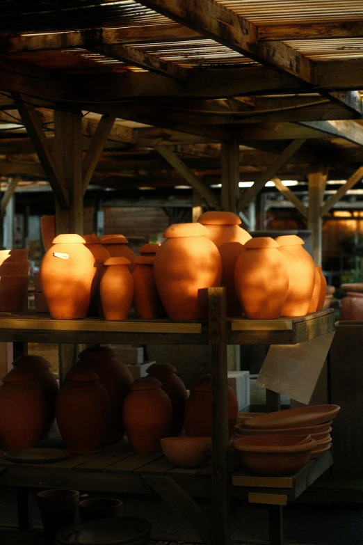 some jars and vases in an old building