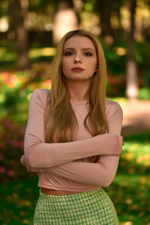 a girl with long hair is posing for a po